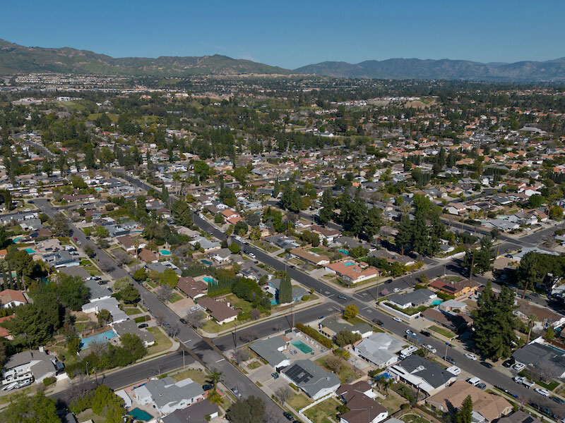 Aerial view of the San Fernando Valley with red-tile roof hillside homes